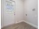 Laundry room with vinyl flooring and exterior access at 3409 E Comanche Ave, Tampa, FL 33610