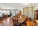 Charming dining room with wood table and chairs, hardwood floors at 35138 Dale Ave, Zephyrhills, FL 33541