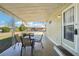 Covered porch with outdoor seating, perfect for relaxing at 35138 Dale Ave, Zephyrhills, FL 33541