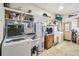 Laundry room with washer, dryer, and ample storage at 35138 Dale Ave, Zephyrhills, FL 33541
