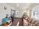 Spacious sunroom with couch, providing extra living space at 35138 Dale Ave, Zephyrhills, FL 33541