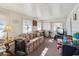 Sunroom with floral couch and view of the neighborhood at 35138 Dale Ave, Zephyrhills, FL 33541