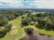 Aerial view of the golf course with a pond at 36819 Kiowa Ave, Zephyrhills, FL 33542