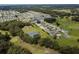 Aerial view of community with tennis courts and homes at 36819 Kiowa Ave, Zephyrhills, FL 33542