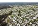 Aerial view of community with many mobile homes and a pool at 36819 Kiowa Ave, Zephyrhills, FL 33542