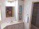 Bathroom with single vanity, mirrored cabinet, and shower at 36819 Kiowa Ave, Zephyrhills, FL 33542
