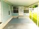 Covered patio with concrete flooring and access to the front door at 36819 Kiowa Ave, Zephyrhills, FL 33542