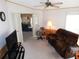 Gathering room featuring a large TV and comfortable seating at 36819 Kiowa Ave, Zephyrhills, FL 33542