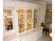 Elegant built-in hutch with glass doors and interior lighting at 36819 Kiowa Ave, Zephyrhills, FL 33542
