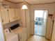 Convenient laundry room with washer, dryer, and access to a sunroom at 36819 Kiowa Ave, Zephyrhills, FL 33542