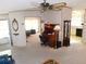 Open living area with built-in shelving and carpeted floor at 36819 Kiowa Ave, Zephyrhills, FL 33542