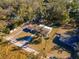 Aerial view showing a home's location, yard, and neighborhood setting at 38214 Jendral Ave, Zephyrhills, FL 33542