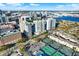 Wide aerial view of building, tennis courts, and city at 450 Knights Run Ave # 605, Tampa, FL 33602