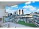Private balcony overlooking a resort-style pool and city skyline at 450 Knights Run Ave # 605, Tampa, FL 33602