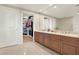 Double vanity bathroom with large walk-in closet at 450 Knights Run Ave # 605, Tampa, FL 33602