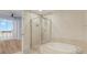 Elegant bathroom featuring a soaking tub and walk-in shower at 450 Knights Run Ave # 605, Tampa, FL 33602