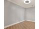 Simple bedroom with wood floors and neutral wall colors at 450 Knights Run Ave # 605, Tampa, FL 33602