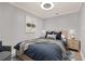 Cozy bedroom with light walls, wood floors, and ceiling fan at 450 Knights Run Ave # 605, Tampa, FL 33602