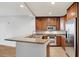 Modern kitchen with granite countertops and stainless steel appliances at 450 Knights Run Ave # 605, Tampa, FL 33602
