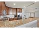 Modern kitchen with granite counters and stainless steel appliances at 450 Knights Run Ave # 605, Tampa, FL 33602
