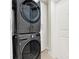 Stackable LG washer and dryer in a well-lit laundry room at 450 Knights Run Ave # 605, Tampa, FL 33602