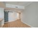 Open living area with hardwood floors and barn door at 450 Knights Run Ave # 605, Tampa, FL 33602