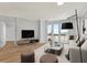 Bright living room with hardwood floors, city view, and comfortable seating at 450 Knights Run Ave # 605, Tampa, FL 33602