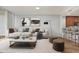 Open living room showcasing stylish furnishings and access to the kitchen at 450 Knights Run Ave # 605, Tampa, FL 33602