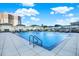 Inviting rectangular pool with lounge chairs and building view at 450 Knights Run Ave # 605, Tampa, FL 33602