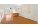 Simple dining room featuring wood flooring and a mural at 4746 Azalea Dr # 203C, New Port Richey, FL 34652