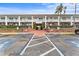 Building exterior with parking and entrance at 4746 Azalea Dr # 203C, New Port Richey, FL 34652
