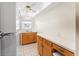 View of kitchen with wood cabinets, white appliances, and tiled floor at 4746 Azalea Dr # 203C, New Port Richey, FL 34652
