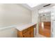 View from kitchen to dining room, showing wood cabinets and countertops at 4746 Azalea Dr # 203C, New Port Richey, FL 34652