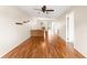 Spacious living room with hardwood floors and access to kitchen and other rooms at 4746 Azalea Dr # 203C, New Port Richey, FL 34652
