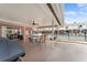 Covered patio with outdoor seating and grilling area at 4746 Azalea Dr # 203C, New Port Richey, FL 34652