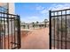 Inviting community pool area with surrounding patio tables and umbrellas at 4746 Azalea Dr # 203C, New Port Richey, FL 34652