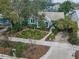 Property view showcasing landscaping and setting at 546 Orangewood Dr, Dunedin, FL 34698