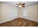 Well-lit bedroom with hardwood floors and ceiling fan at 546 Orangewood Dr, Dunedin, FL 34698