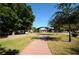 Park with a brick pathway and green lawns at 546 Orangewood Dr, Dunedin, FL 34698