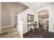 Bright entryway with hardwood floors, staircase, and view into the living area at 5701 S Macdill Ave, Tampa, FL 33611