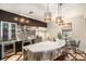 Modern kitchen with stainless steel appliances and a curved island at 5701 S Macdill Ave, Tampa, FL 33611