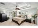 Spacious main bedroom with plush bedding and tray ceiling at 5701 S Macdill Ave, Tampa, FL 33611