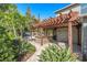 Outdoor kitchen with pergola and stone countertop at 5701 S Macdill Ave, Tampa, FL 33611