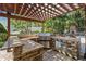 Outdoor kitchen with granite countertops and built-in grill at 5701 S Macdill Ave, Tampa, FL 33611