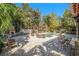 Private backyard with a stunning pool and multiple seating areas at 5701 S Macdill Ave, Tampa, FL 33611