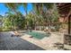 Spacious backyard with a refreshing pool and multiple seating areas at 5701 S Macdill Ave, Tampa, FL 33611