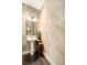 Elegant powder room with pedestal sink and patterned wallpaper at 5701 S Macdill Ave, Tampa, FL 33611