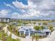 Community pool, clubhouse, and lakefront boardwalk with palm trees at 7205 Sutton Ln, Sarasota, FL 34240