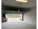 Spacious garage with an automatic door opener and overhead storage at 7205 Sutton Ln, Sarasota, FL 34240