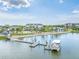 Community boat dock on a serene lake with resort amenities at 7205 Sutton Ln, Sarasota, FL 34240